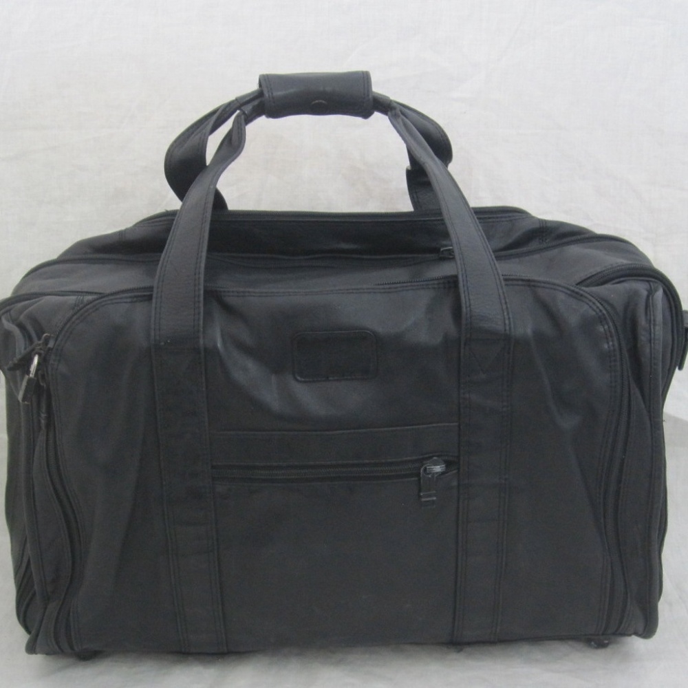 SOLD ON E BAY TUMI black  duffel luggage